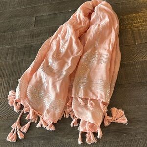 Scarf is peach and silver